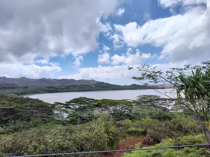 Waita Reservoir below green hills seen from the Koloa course